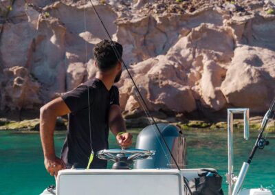 A young man out fishing with the tender